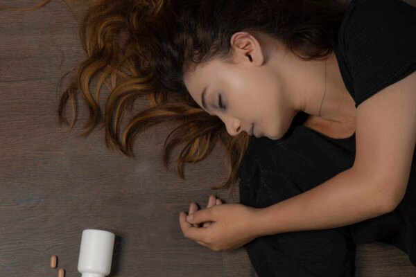 Young girl committed suicide and laying on the ground.